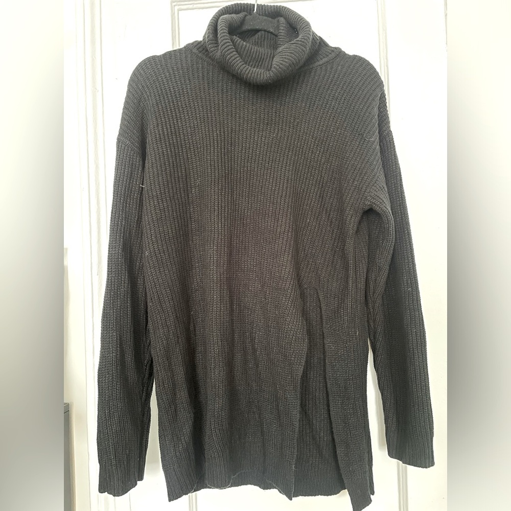 Black oversized turtleneck sweater w/ large slit